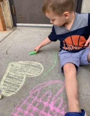 Warm weather means chalk drawing outside.