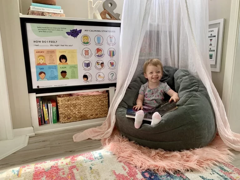 Toddler sitting happy in the Calming Corner