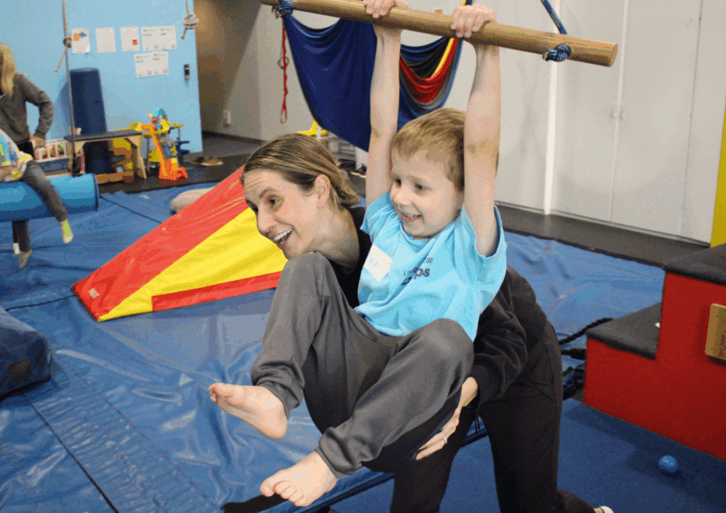 Pediatric Physical Therapy in Chicago - Therapist and Child ziplining