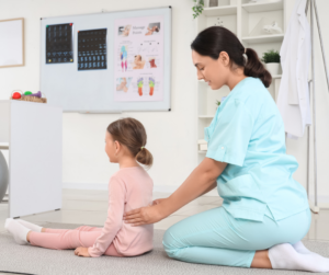 Therapist and Child work on spine alignment