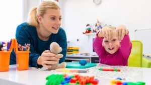 Multidisciplinary Team at CPTWC Therapist and child working together