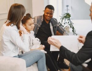 Evaluation Process Family sitting down talking to doctor